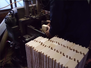 Side pieces of the masu cups with finger tenons cut into them, ready for joinery